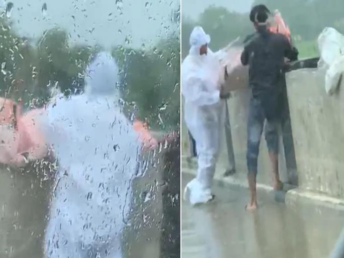 Man in PPE kit throws body into river in UPs Balrampur incident caught on camera | CoronaVirus News: धक्कादायक! दोघांनी कोरोना रुग्णाचा मृतदेह नदीत फेकला; व्हिडीओ व्हायरल Man in PPE kit throws body into river in UPs Balrampur incident caught on camera | CoronaVirus News: धक्कादायक! दोघांनी कोरोना रुग्णाचा मृतदेह नदीत फेकला; व्हिडीओ व्हायरल