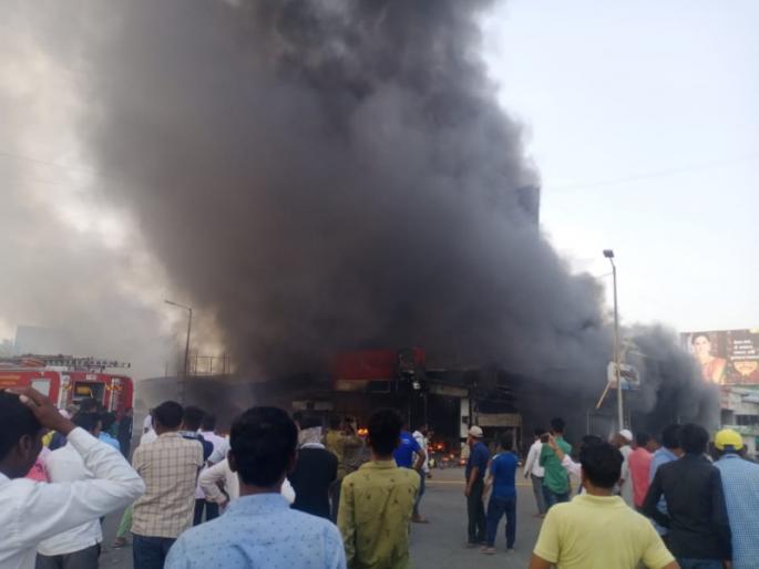 Fierce fire at 8 shops including Misal Hotel at Kharadi in Pune; Attempts to extinguish the fire continue | Video: पुण्यात खराडी येथे मिसळच्या हॉटेलसहित ८ दुकानांना भीषण आग; आग विझवण्याचे प्रयत्न सुरू Fierce fire at 8 shops including Misal Hotel at Kharadi in Pune; Attempts to extinguish the fire continue | Video: पुण्यात खराडी येथे मिसळच्या हॉटेलसहित ८ दुकानांना भीषण आग; आग विझवण्याचे प्रयत्न सुरू