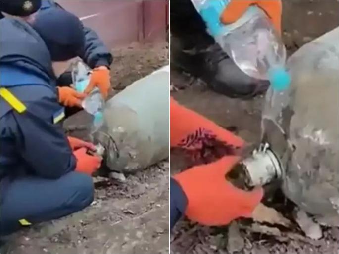 Russia Ukrain war Ukrainian defusing bombs with water video viral | Russia Ukrain war : रशियानं टाकला विशाल बॉम्ब, युक्रेनच्या सैनिकांनी पाणी टाकून केला डिफ्यूज; बघा थरकाप उडवणारा VIDEO 