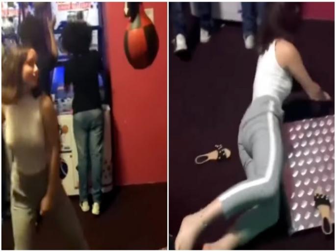 Girl was hitting the ball slipped and fall on the ground | VIDEO : गेमिंग झोनमध्ये तरूणीसोबत झालं असं काही, थेट पडली तोंडावर... Girl was hitting the ball slipped and fall on the ground | VIDEO : गेमिंग झोनमध्ये तरूणीसोबत झालं असं काही, थेट पडली तोंडावर...