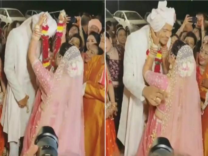 The bridegroom kissed the bride in front of everyone while entering, the people kept looking | बाबो! नवऱ्याने एंट्री करतचा नवरीला सर्वांसमोर केले किस, बघतच राहिले वऱ्हाडी The bridegroom kissed the bride in front of everyone while entering, the people kept looking | बाबो! नवऱ्याने एंट्री करतचा नवरीला सर्वांसमोर केले किस, बघतच राहिले वऱ्हाडी