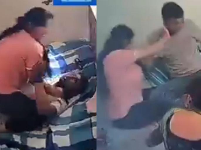 madhya pradesh Husband says Save me from my wife Woman brutally beats husband while sitting on his chest in front of mother and brother; Video Viral | "बायकोपासून वाचवा...!" आई आणि भावासमोर छातीवर बसून महिलेची पतीला बेदम मारहाण; Video Viral  madhya pradesh Husband says Save me from my wife Woman brutally beats husband while sitting on his chest in front of mother and brother; Video Viral | "बायकोपासून वाचवा...!" आई आणि भावासमोर छातीवर बसून महिलेची पतीला बेदम मारहाण; Video Viral
