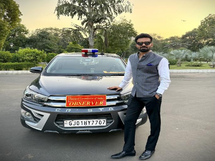 election commission removed ias officer abhishek singh-from gujarat poll duty for social media photo | गुजरात इलेक्शन ड्युटी लागली, IAS अधिकाऱ्याने कारसोबत पोझ दिली, निवडणूक आयोगाने घेतली दखल election commission removed ias officer abhishek singh-from gujarat poll duty for social media photo | गुजरात इलेक्शन ड्युटी लागली, IAS अधिकाऱ्याने कारसोबत पोझ दिली, निवडणूक आयोगाने घेतली दखल