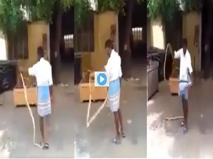 lungi man : lungi man play with snake and put it in his lungi video goes viral on social media | lungi man : बाबो! आधी सापाला उचललं अन् मग लुंगीत सोडलं; नंतर घडलं असं काही...... lungi man : lungi man play with snake and put it in his lungi video goes viral on social media | lungi man : बाबो! आधी सापाला उचललं अन् मग लुंगीत सोडलं; नंतर घडलं असं काही......