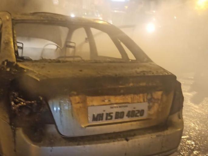 Panic over car fire in Thane | ठाण्यात कारला आग लागल्याने घबराट Panic over car fire in Thane | ठाण्यात कारला आग लागल्याने घबराट