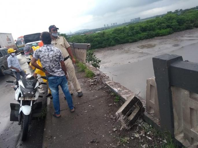 Accident to Bhardhaw container after breaking the wall of Kharegaon bridge on Mumbai-Nashik highway | मुंबई-नाशिक महामार्गावरील खारेगाव पुलाचा कठडा तोडून भरधाव कंटेनरला अपघात  Accident to Bhardhaw container after breaking the wall of Kharegaon bridge on Mumbai-Nashik highway | मुंबई-नाशिक महामार्गावरील खारेगाव पुलाचा कठडा तोडून भरधाव कंटेनरला अपघात