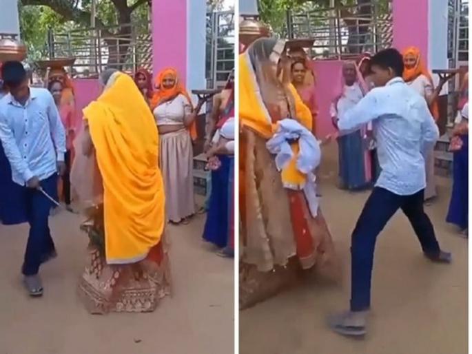 Viral video : Brother in law beats up sister in law during marriage ritual funny video goes viral | VIDEO : रिवाजानुसार छडीने हळूहळू मारता मारता दिराने खरंच नव्या वहिनीची केली धुलाई, नवरदेव पेटला आणि.... Viral video : Brother in law beats up sister in law during marriage ritual funny video goes viral | VIDEO : रिवाजानुसार छडीने हळूहळू मारता मारता दिराने खरंच नव्या वहिनीची केली धुलाई, नवरदेव पेटला आणि....