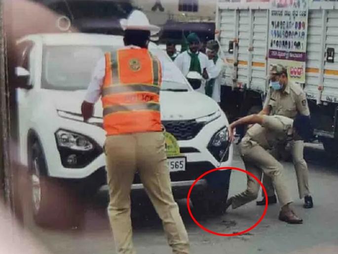 Shocking incident during 'Bharat Bandh', a car crashed to DCP dharmendra meena in banglore | 'भारत बंद'दरम्यान धक्कादायक घटना, पोलिस अधिकाऱ्याच्या पायावर चढवली कार Shocking incident during 'Bharat Bandh', a car crashed to DCP dharmendra meena in banglore | 'भारत बंद'दरम्यान धक्कादायक घटना, पोलिस अधिकाऱ्याच्या पायावर चढवली कार