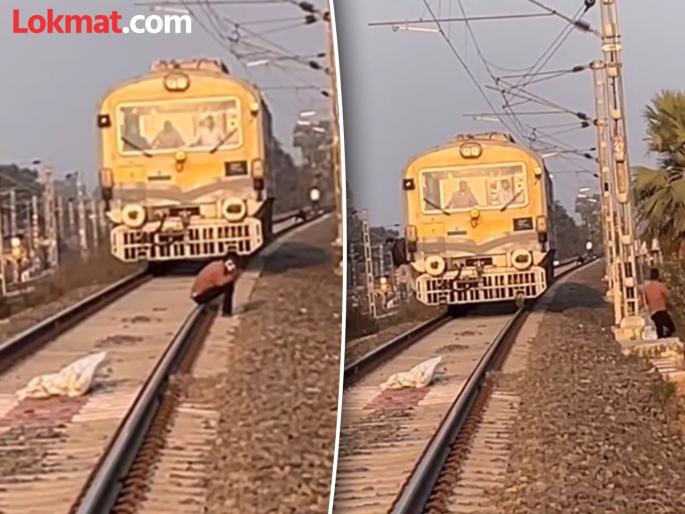 Viral video : The boy was sitting on the train track angry loco pilot threw a brick and hit him | रेल्वेच्या ट्रॅकवर बसून फोनवर बोलत होता तरूण, मागून आलं रेल्वेचं इंजिन आणि मग... Viral video : The boy was sitting on the train track angry loco pilot threw a brick and hit him | रेल्वेच्या ट्रॅकवर बसून फोनवर बोलत होता तरूण, मागून आलं रेल्वेचं इंजिन आणि मग...