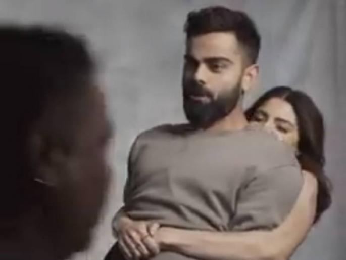 virat kohli anushka sharma viral video actress lifts the captain during photoshoot shows her muscles power winning hearts | Viral Video: अनुष्कानं विराटला हात पकडून उचललं; कोहलीच्या तोंडून पटकन निघालं...