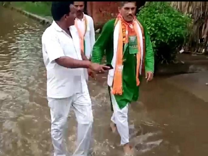 hapur angry public made bjp mla kamal malik run in sewer water | VIDEO: ओ शेठ, तुम्ही नादच केलाय थेट! ग्रामस्थांनी भाजप आमदाराला गटाराच्या पाण्यातून चालवलं