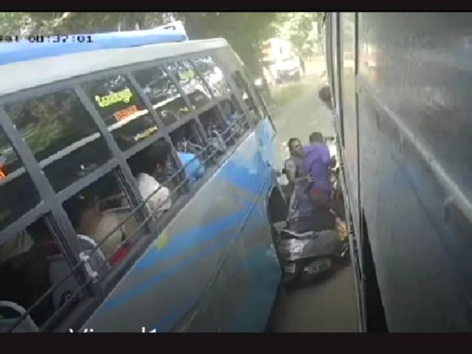 Scooty Collides With Two Buses Miraculous Escape For Husband Wife And Infant Watch Viral Video | अति घाई, संकटात नेई! स्कूटर चालकाचा अंदाज चुकला; दोन चालत्या बसेसमध्ये जाऊन अडकला अन् मग... Scooty Collides With Two Buses Miraculous Escape For Husband Wife And Infant Watch Viral Video | अति घाई, संकटात नेई! स्कूटर चालकाचा अंदाज चुकला; दोन चालत्या बसेसमध्ये जाऊन अडकला अन् मग...