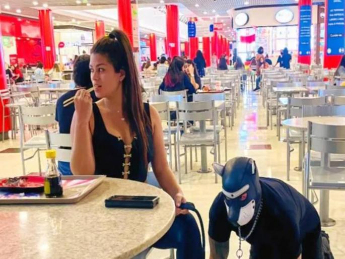 woman walks husband like dog on leash bizarre moment photos | ...म्हणून मी पतीला कुत्र्याप्रमाणे वागवते, साखळी बांधून फिरवते; पत्नीनं सांगितलं अजब कारण woman walks husband like dog on leash bizarre moment photos | ...म्हणून मी पतीला कुत्र्याप्रमाणे वागवते, साखळी बांधून फिरवते; पत्नीनं सांगितलं अजब कारण