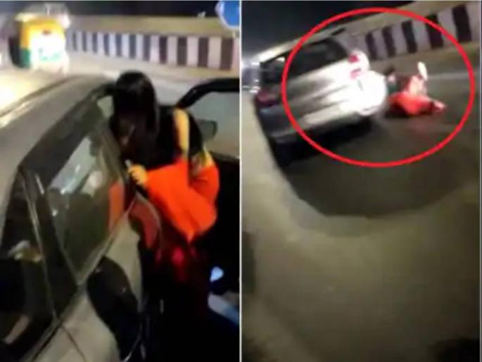Delhi Woman dragged, slapped by two youths in car after she tries to intervene between arguing drivers | भांडण मिटवणे महागात पडले; तरुणांनी महिलेच्या कानशिलात लगावली, कारसोबत फरफटत नेले Delhi Woman dragged, slapped by two youths in car after she tries to intervene between arguing drivers | भांडण मिटवणे महागात पडले; तरुणांनी महिलेच्या कानशिलात लगावली, कारसोबत फरफटत नेले