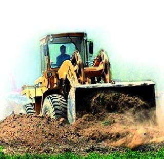 Bulldozer on tribal lands | आदिवासींच्या जमिनींवर बुलडोझर