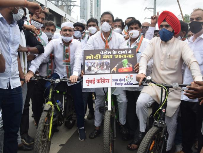 mumbai congress petrol diesel price hiike hema malini smriti irani why not asking this time asked congress | पेट्रोल, डिझेलच्या दरवाढी विरोधात मुंबई काँग्रेसचा बैलगाडी, सायकल चालवत निषेध मोर्चा mumbai congress petrol diesel price hiike hema malini smriti irani why not asking this time asked congress | पेट्रोल, डिझेलच्या दरवाढी विरोधात मुंबई काँग्रेसचा बैलगाडी, सायकल चालवत निषेध मोर्चा