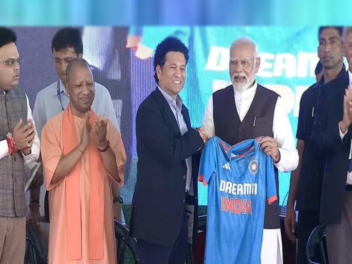 PM Modi lays foundation stone of international cricket stadium in Varanasi and Sachin Tendulkar presented PM Narendra Modi team India jersey, read here | वाराणसीत होणार आंतरराष्ट्रीय स्टेडियम; PM मोदींच्या हस्ते पायाभरणी; सचिनसह दिग्गजांची उपस्थिती PM Modi lays foundation stone of international cricket stadium in Varanasi and Sachin Tendulkar presented PM Narendra Modi team India jersey, read here | वाराणसीत होणार आंतरराष्ट्रीय स्टेडियम; PM मोदींच्या हस्ते पायाभरणी; सचिनसह दिग्गजांची उपस्थिती