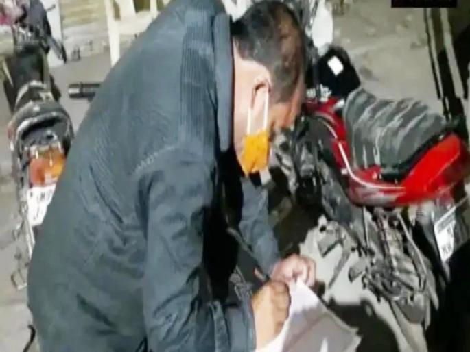 coronavirus mp cop asked to pen down the name of lord ram after violating lockdown rules | CoronaVirus: लॉकडाऊनचे नियम मोडणाऱ्यांवर अनोखी कारवाई; ४० मिनिटे रामनाम लिहिण्याची शिक्षा coronavirus mp cop asked to pen down the name of lord ram after violating lockdown rules | CoronaVirus: लॉकडाऊनचे नियम मोडणाऱ्यांवर अनोखी कारवाई; ४० मिनिटे रामनाम लिहिण्याची शिक्षा