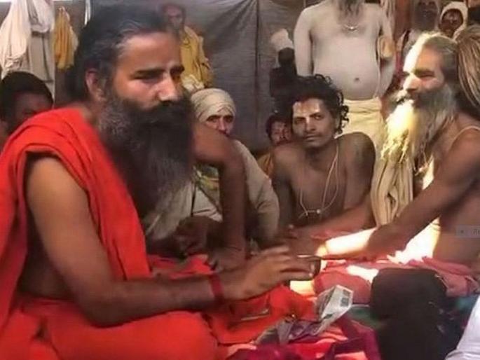 Yog guru Ramdev urged saints and seers at the Kumbh Mela to quit smoking | धूम्रपान सोडा, रामदेव बाबांचं कुंभमेळ्यातील साधूंना आवाहन Yog guru Ramdev urged saints and seers at the Kumbh Mela to quit smoking | धूम्रपान सोडा, रामदेव बाबांचं कुंभमेळ्यातील साधूंना आवाहन