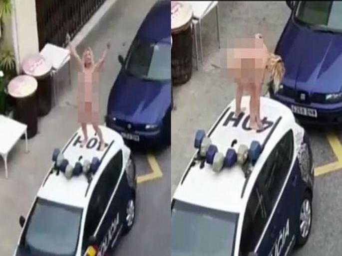 Video : Spain woman strips naked stands atop police car after being called to court for flouting lockdown api | Video : लॉकडाऊनमध्ये थेट पोलिसांच्या गाडीवर निर्वस्त्र होऊन महिलेचा धिंगाणा, पण का? Video : Spain woman strips naked stands atop police car after being called to court for flouting lockdown api | Video : लॉकडाऊनमध्ये थेट पोलिसांच्या गाडीवर निर्वस्त्र होऊन महिलेचा धिंगाणा, पण का?