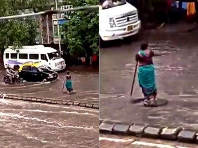Viral Video : Lady has open the manhole and standing there since last 5 hours in Mumbai rains | Video! सलाम! भर पावसात तब्बल ५ तास उभी राहिली महिला, जेणेकरून काही दुर्घटना होऊ नये... Viral Video : Lady has open the manhole and standing there since last 5 hours in Mumbai rains | Video! सलाम! भर पावसात तब्बल ५ तास उभी राहिली महिला, जेणेकरून काही दुर्घटना होऊ नये...
