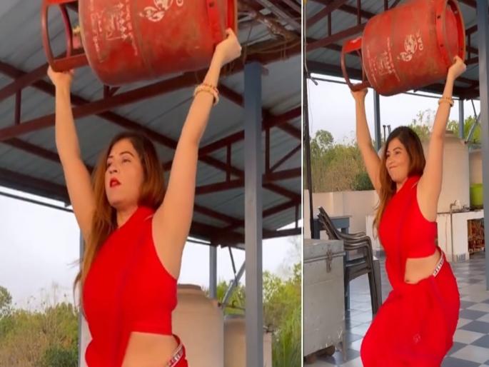 Women in red sari exercises with a gas cylinder viral instagram videos | लेडी बाहुबली! गॅस सिलेंडरसोबत वर्कआउट करते ही महिला, तेही नाडी नेसून; व्हिडीओ व्हायरल Women in red sari exercises with a gas cylinder viral instagram videos | लेडी बाहुबली! गॅस सिलेंडरसोबत वर्कआउट करते ही महिला, तेही नाडी नेसून; व्हिडीओ व्हायरल