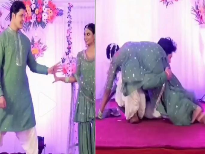 Wedding video : Groom and bride falling on stage video goes viral on internet | VIDEO : स्टेजवर डान्स करता करता पडले नवरी-नवरदेव आणि मग... Wedding video : Groom and bride falling on stage video goes viral on internet | VIDEO : स्टेजवर डान्स करता करता पडले नवरी-नवरदेव आणि मग...