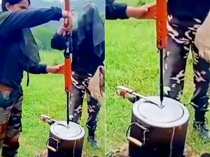 woman soldiers cooks food with help of gun use gun as pressure cooker whistle | महिला सैनिकांनी बंदुकीचा उपयोग करुन शिजवलं जेवणं, व्हिडिओ पाहुन होईल थरकाप woman soldiers cooks food with help of gun use gun as pressure cooker whistle | महिला सैनिकांनी बंदुकीचा उपयोग करुन शिजवलं जेवणं, व्हिडिओ पाहुन होईल थरकाप