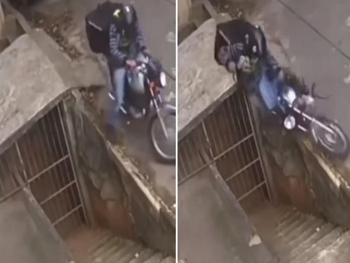 Weird accident video goes viral, man saved his life smartly | VIDEO : बाइक स्टॅंडवर लावताना घडला असा विचित्र अपघात, ज्याची त्याने कल्पनाही केली नसेल... Weird accident video goes viral, man saved his life smartly | VIDEO : बाइक स्टॅंडवर लावताना घडला असा विचित्र अपघात, ज्याची त्याने कल्पनाही केली नसेल...