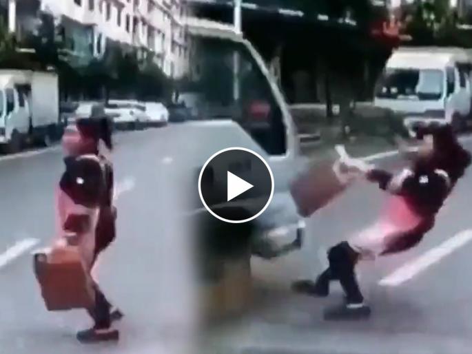 woman came under truck while crossing road shocking accident goes viral see what happens next | रस्ता ओलांडताना भरधाव ट्रकच्या खाली आली महिला, पण साधं खरचंटलंही नाही! कसं? पाहा woman came under truck while crossing road shocking accident goes viral see what happens next | रस्ता ओलांडताना भरधाव ट्रकच्या खाली आली महिला, पण साधं खरचंटलंही नाही! कसं? पाहा