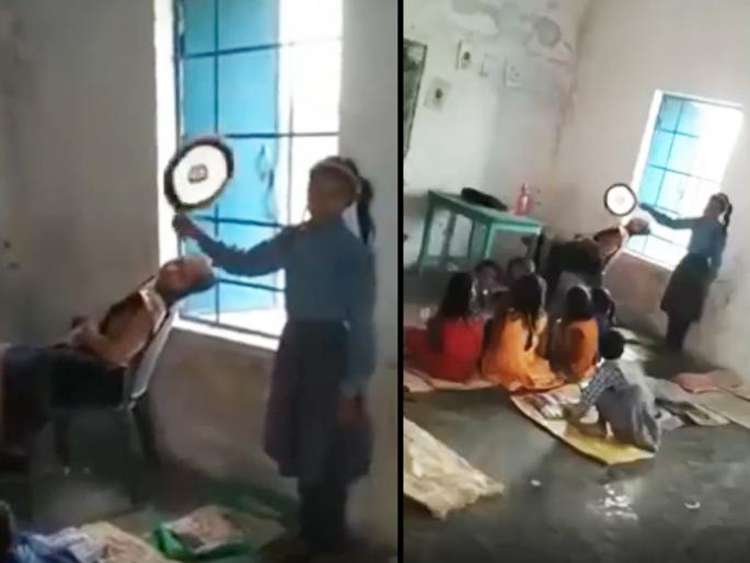teacher is sleeping in the class video goes viral on social media netizens are angry | Viral Video: शाळेमध्ये आरामात झोपल्या आहेत शिक्षिका, मॅडमना हवा घालायला विद्यार्थी कामाला