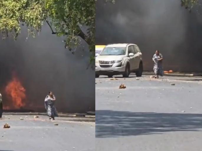 Mother fought through a fire storm to save her son in the Ahmedabad plane crash | मुलाला वाचवण्यासाठी आगीशी झुंजत होती आई; अहमदाबाद विमान अपघाताचा हादरवून टाकणारा VIDEO Mother fought through a fire storm to save her son in the Ahmedabad plane crash | मुलाला वाचवण्यासाठी आगीशी झुंजत होती आई; अहमदाबाद विमान अपघाताचा हादरवून टाकणारा VIDEO