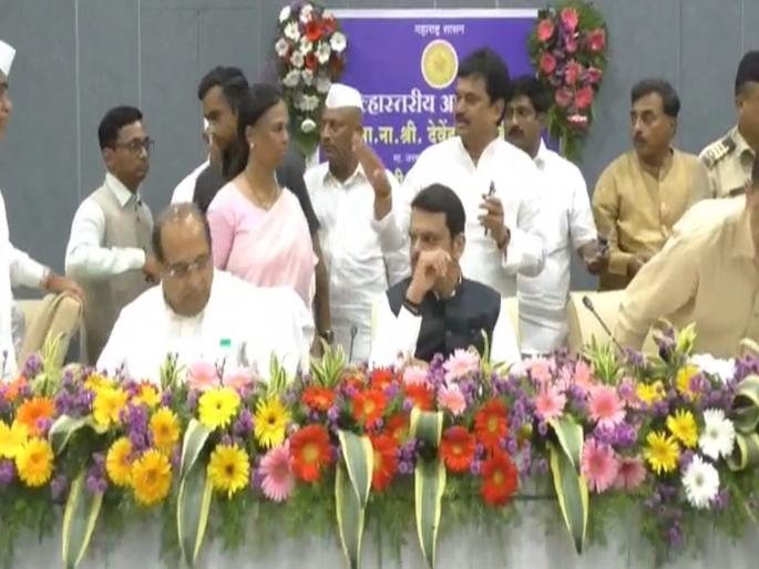 Not getting a chair, Ram Shinde got down under the stage; What happened in front of Devendra Fadnavis | खुर्ची न मिळाल्याने राम शिंदे उतरले स्टेजच्याखाली; देवेंद्र फडणवीसांसमोर घडला प्रकार Not getting a chair, Ram Shinde got down under the stage; What happened in front of Devendra Fadnavis | खुर्ची न मिळाल्याने राम शिंदे उतरले स्टेजच्याखाली; देवेंद्र फडणवीसांसमोर घडला प्रकार