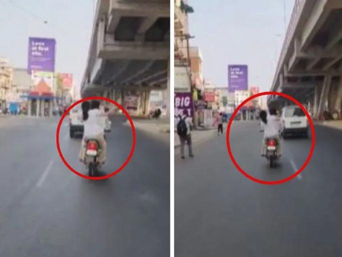 Lucknow Video: Young woman beats young man with slippers on a running bike | VIDEO: धावत्या बाईकवर तरुणीची तरुणाला चप्पलने मारहाण; 20 सेकंदात 14 वेळा झोडपले Lucknow Video: Young woman beats young man with slippers on a running bike | VIDEO: धावत्या बाईकवर तरुणीची तरुणाला चप्पलने मारहाण; 20 सेकंदात 14 वेळा झोडपले