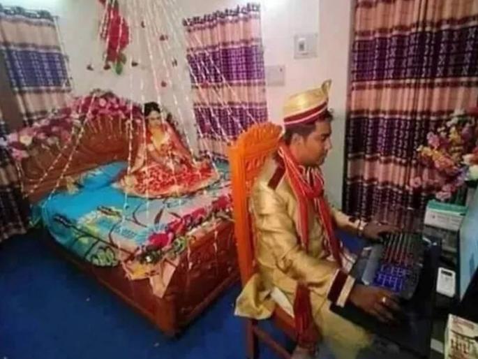 Viral news in Marathi : Viral pic man was using computer while bride was waiting for him | कमालच केली राव! पहिल्या रात्री बायको बघत होती वाट; अन् हा पठ्ठ्या बसला काम करत, लोक म्हणाले.... Viral news in Marathi : Viral pic man was using computer while bride was waiting for him | कमालच केली राव! पहिल्या रात्री बायको बघत होती वाट; अन् हा पठ्ठ्या बसला काम करत, लोक म्हणाले....