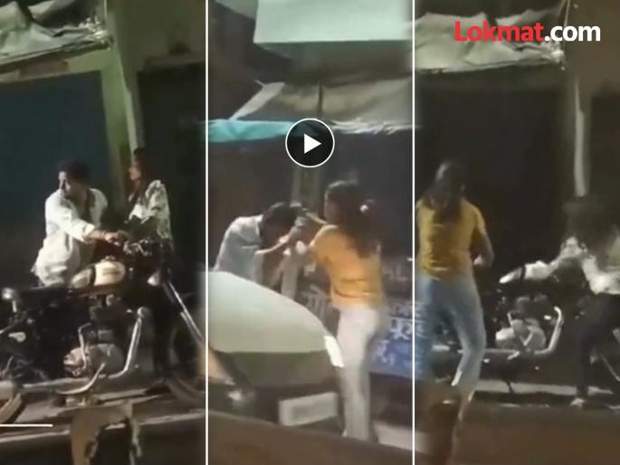 two girls beat bullet rider boy for teasing in varanasi video goes viral | Viral Video : बुलेटस्वार तरुणाला दोघींनी दिला चोप, सुटका करून घेत...; पहा व्हिडीओ two girls beat bullet rider boy for teasing in varanasi video goes viral | Viral Video : बुलेटस्वार तरुणाला दोघींनी दिला चोप, सुटका करून घेत...; पहा व्हिडीओ