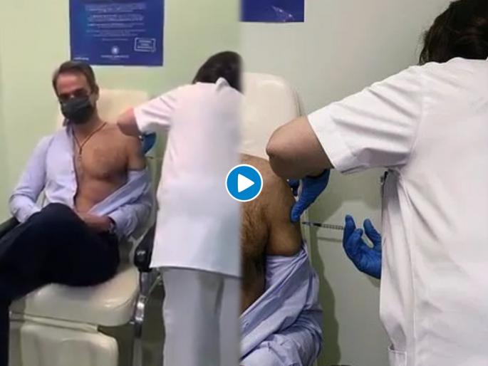 This is how greece pm take vaccine netizens are gone crazy | पंतप्रधानांनी थेट शर्ट काढूनच टोचून घेतली कोरोना लस; अन् फोटो झाला व्हायरल, लोक म्हणाले..... This is how greece pm take vaccine netizens are gone crazy | पंतप्रधानांनी थेट शर्ट काढूनच टोचून घेतली कोरोना लस; अन् फोटो झाला व्हायरल, लोक म्हणाले.....