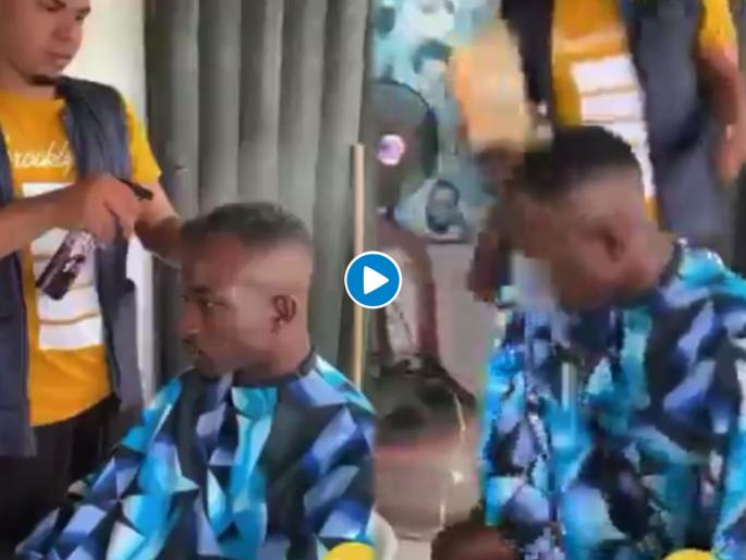 Barber repeatedly straying water on customer man put whole bucket on body funny video goes viral | Barber repeatedly straying water: बोंबला! केसातून पाणी गळेपर्यंत न्हाव्यानं स्प्रे मारला; अन् रागाच्या भरात पठ्ठ्यानं केलं असं काही...... Barber repeatedly straying water on customer man put whole bucket on body funny video goes viral | Barber repeatedly straying water: बोंबला! केसातून पाणी गळेपर्यंत न्हाव्यानं स्प्रे मारला; अन् रागाच्या भरात पठ्ठ्यानं केलं असं काही......