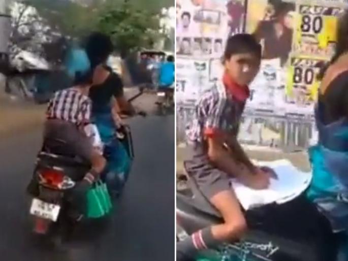 student doing homework on scooty while his mother is driving goes viral on social media | धावत्या स्कुटीवर हा करतोय होम वर्क, नेटकरी म्हणाले इतका अभ्यासू मुलगा जगात सापडणार नाही student doing homework on scooty while his mother is driving goes viral on social media | धावत्या स्कुटीवर हा करतोय होम वर्क, नेटकरी म्हणाले इतका अभ्यासू मुलगा जगात सापडणार नाही
