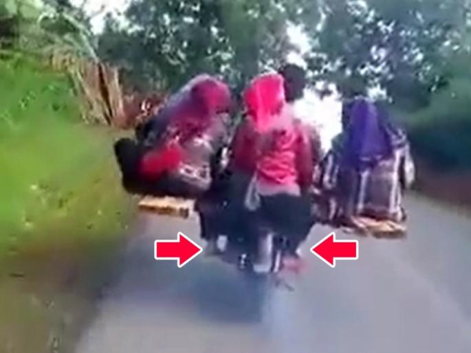 desi jugaad of man riding bike with 9 passengers video goes viral on social media | अरे...बाईक आहे की प्लेन? देसी जुगाडाचा हा भन्नाट व्हिडिओ पाहुन तुम्हालाही पडेल हाच प्रश्न desi jugaad of man riding bike with 9 passengers video goes viral on social media | अरे...बाईक आहे की प्लेन? देसी जुगाडाचा हा भन्नाट व्हिडिओ पाहुन तुम्हालाही पडेल हाच प्रश्न