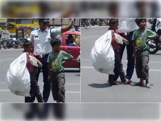 traffic constable ranjeet singh helped kid pic goes viral | वर्दीतील माणुसकी! कडाक्याचा उन्हात मुलाचे भाजत होते पाय; पोलिसाने स्वत:च्या पायावर केलं उभं traffic constable ranjeet singh helped kid pic goes viral | वर्दीतील माणुसकी! कडाक्याचा उन्हात मुलाचे भाजत होते पाय; पोलिसाने स्वत:च्या पायावर केलं उभं