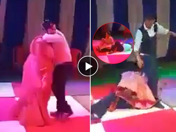 Man lifting the woman in his lap on dance floor fell down badly internet loves this funny viral video | लग्नात नाचताना उत्साहात बायकोला उचलायला गेला अन् स्वत:च दणकन आपटला व्हायरल व्हिडिओ