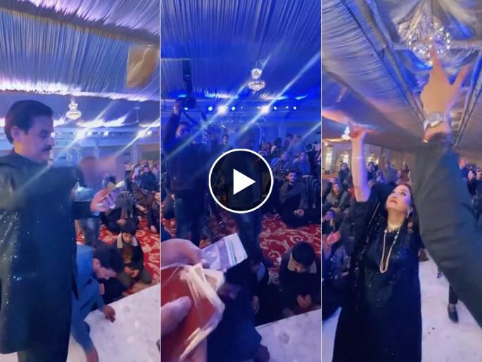 the man blew gold coins at the wedding video goes viral | Video - सोन्याचा वर्षाव! लग्नात उडवली चक्क सोन्याची नाणी, जमवण्यासाठी पाहुण्याची झुंबड the man blew gold coins at the wedding video goes viral | Video - सोन्याचा वर्षाव! लग्नात उडवली चक्क सोन्याची नाणी, जमवण्यासाठी पाहुण्याची झुंबड