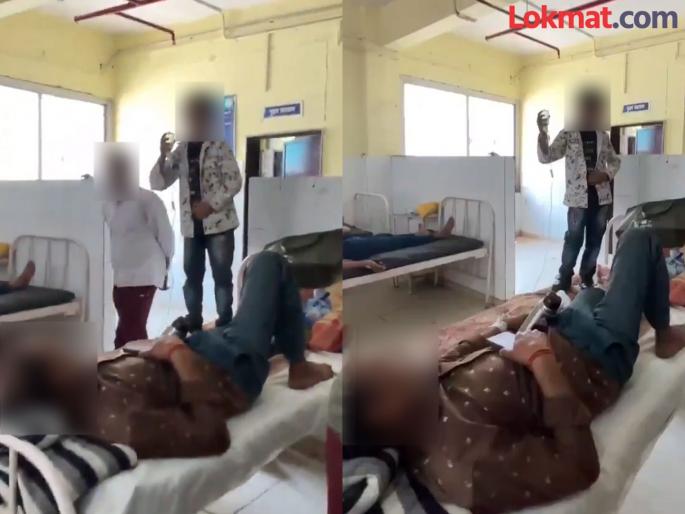 tikamgarh govt hospital ward boy suspended in child forced to hold iv bottle during fathers treatment case | Video - रुग्णालयातील धक्कादायक वास्तव; वडील आजारी, मुलाला सलाईन घेऊन बेडवर केलं उभं tikamgarh govt hospital ward boy suspended in child forced to hold iv bottle during fathers treatment case | Video - रुग्णालयातील धक्कादायक वास्तव; वडील आजारी, मुलाला सलाईन घेऊन बेडवर केलं उभं