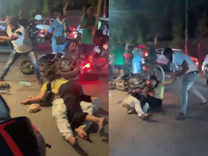 There is no humanity left Couple brutally beaten with bamboo in the middle of the road; People were just watching; Horrifying video | माणुसकी उरली नाही! भररस्त्यात जोडप्याला बांबूने बेदम मारहाण अन् आजूबाजूला बघ्यांची गर्दी, अंगावर काटा आणणारा व्हिडीओ There is no humanity left Couple brutally beaten with bamboo in the middle of the road; People were just watching; Horrifying video | माणुसकी उरली नाही! भररस्त्यात जोडप्याला बांबूने बेदम मारहाण अन् आजूबाजूला बघ्यांची गर्दी, अंगावर काटा आणणारा व्हिडीओ