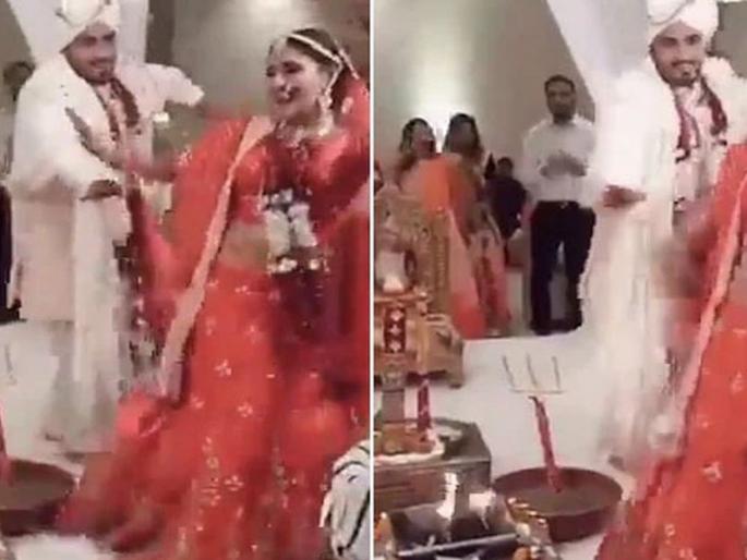 Bride and groom dancing during phera ceremony has divided the internet see viral video | "लग्न आहे की संस्कारांची आहूती?" या जोडप्याला नाचता नाचता सप्तपदी घेताना पाहून; भडकले उद्योगपती; म्हणाले..... Bride and groom dancing during phera ceremony has divided the internet see viral video | "लग्न आहे की संस्कारांची आहूती?" या जोडप्याला नाचता नाचता सप्तपदी घेताना पाहून; भडकले उद्योगपती; म्हणाले.....