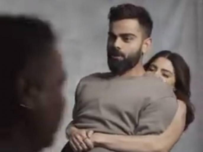 virat kohli anushka sharma viral video actress lifts the captain during photoshoot shows her muscles power winning hearts | Viral Video: अनुष्कानं विराटला हात पकडून उचललं; कोहलीच्या तोंडून पटकन निघालं... virat kohli anushka sharma viral video actress lifts the captain during photoshoot shows her muscles power winning hearts | Viral Video: अनुष्कानं विराटला हात पकडून उचललं; कोहलीच्या तोंडून पटकन निघालं...