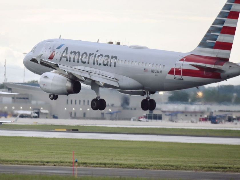 American Airlines flight delayed by 8 hours after a passenger was arrested for joking about having coronavirus kkg | Coronavirus: मला कोरोना झालाय; विमान उड्डाणावेळी 'तो' अचानक ओरडला अन्...
