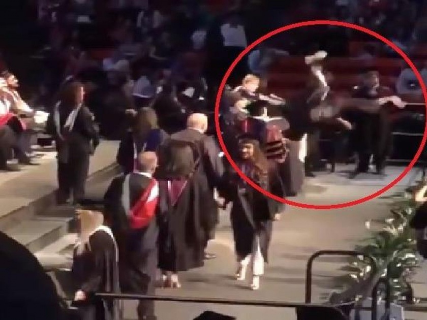 US student attempts a backflip while receiving his diploma injures his neck | Viral Video : डिप्लोमा मिळण्याच्या आनंदात विद्यार्थ्याने केला स्टंट, हिरोगिरी पडली चांगलीच महागात