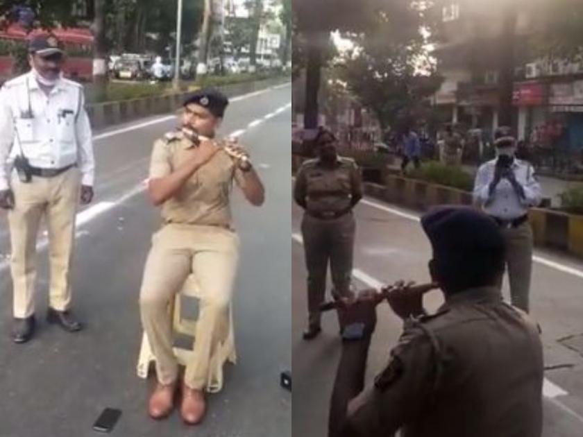 Viral Video Mumbai Police Constable plays flute while sitting on the road, you too will start waving | Viral Video : मुंबई पोलीस काँस्टेबलनं रस्त्यावर बसून वाजवली बासरी, खुश होऊन तुम्हीही डोलायला लागाल
